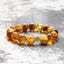 Naturbelassenes Bernsteinarmband mit goldfarbener I LOVE TC Logomünze – handgefertigt | TRI CROWNS